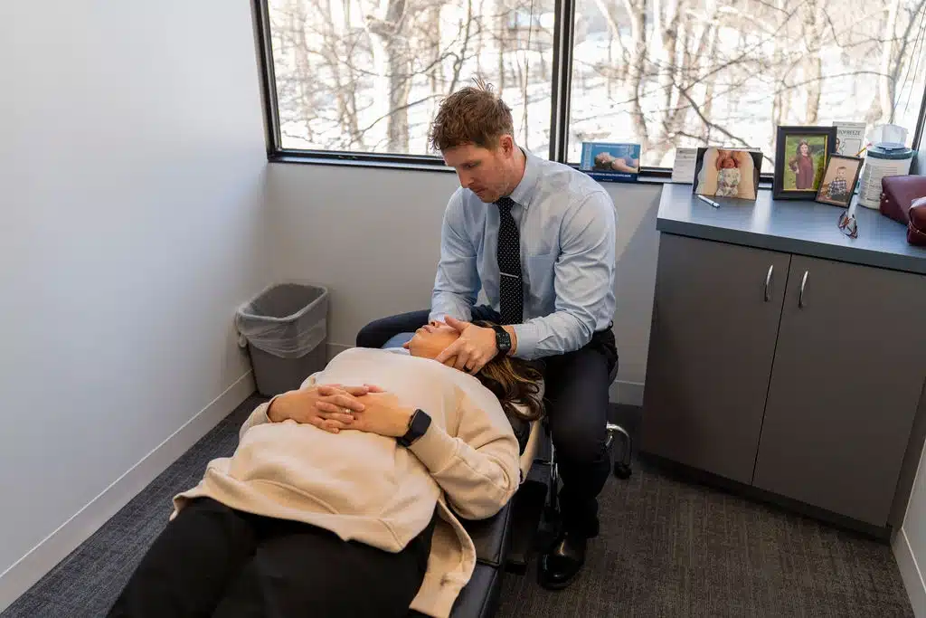 Chiropractor providing hands-on chiropractic care to a patient at ProHealth Chiropractic in Rockville, MD