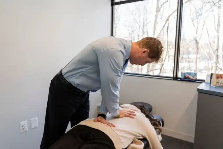 Chiropractor performing a spinal adjustment on a patient at ProHealth Chiropractic in Rockville, MD